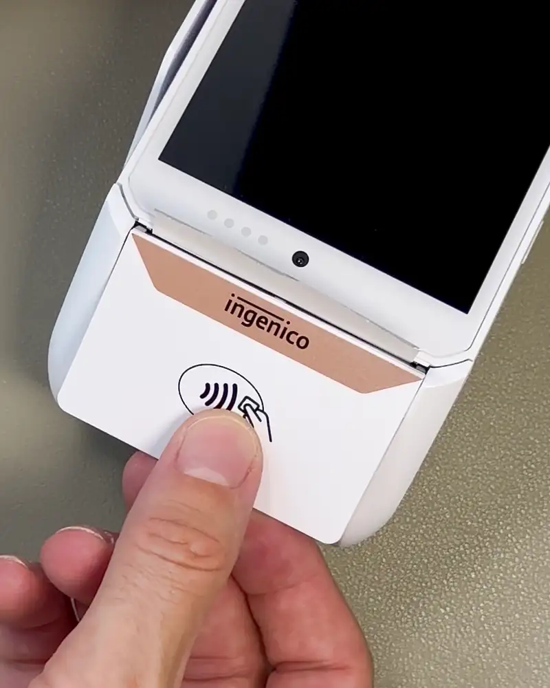 Opening the DX8000 printer lid to reveal the paper roll